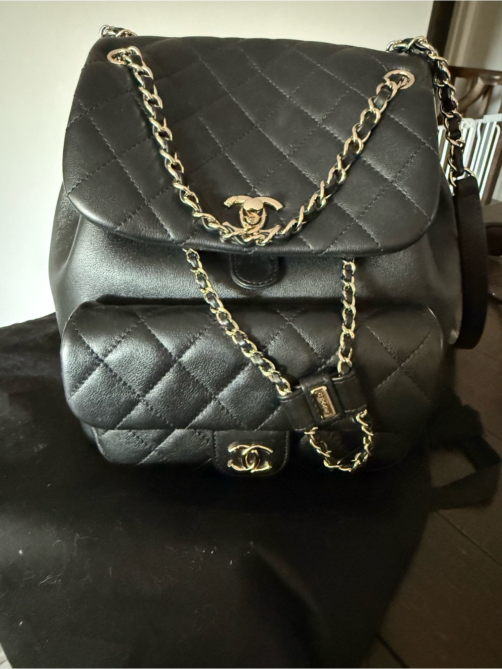 Quilted Black Leather Backpack with Gold Chain Detail